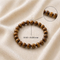 The natural tiger eye bracelet displayed in its presentation packaging for a premium unboxing experience.
