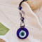 Pyrite evil eye keychain ideal as a gift for wealth attraction, protection, and spiritual growth