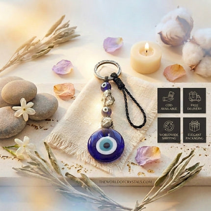 The World of Crystals service overview for the Pyrite Evil Eye keychain including Cash on Delivery, Free Delivery, and Worldwide Shipping