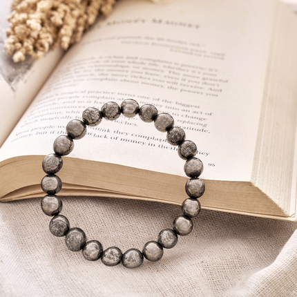 Unpolished metallic pyrite beads on a comfortable stretch cord for spiritual healing and solar plexus chakra work.