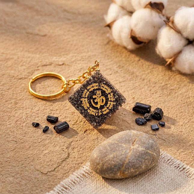 A natural pyrite OM keychain designed to attract wealth and financial abundance.