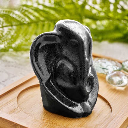 A pyrite crystal Ganesha statue placed on a desk to bring positive Vastu energy to a home office.