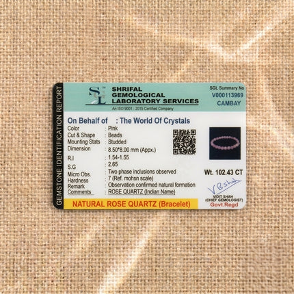 Gemstone identification report from Shrifal Gemological Laboratory for a Natural Rose Quartz bracelet by The World Of Crystals, confirming natural formation and a weight of 102.43 CT.