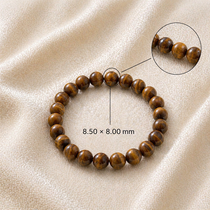 Technical view of the Natural Tiger Eye bracelet showing genuine 8.50 x 8.00 mm chatoyant brown beads on a soft textured fabric