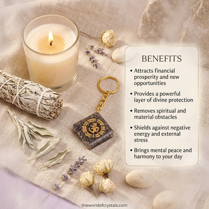 Natural Pyrite OM keychain displayed on a white drawstring gift pouch, highlighted as a meaningful gift for manifesting success and prosperity.
