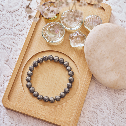 The 100% authentic natural raw pyrite bracelet displayed in its packaging for a premium spiritual gift.