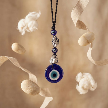 Closeup of raw pyrite evil eye keychain highlighting crystal texture for energy healing and financial prosperity
