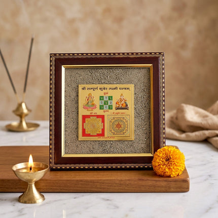 Close-up of the geometric gold-toned yantra symbols with shimmering pyrite for a money manifestation altar.
