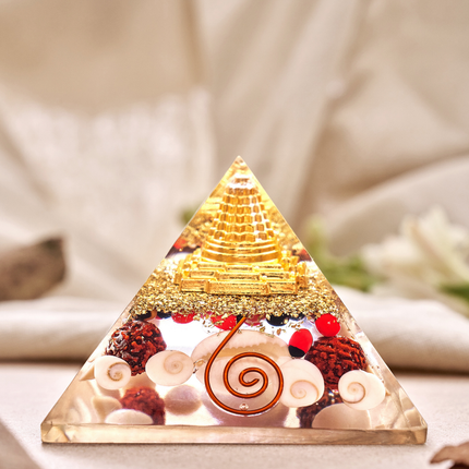 Sacred Shree Yantra and Gomti Chakra orgone pyramid designed to attract wealth, prosperity, and positive energy into your home