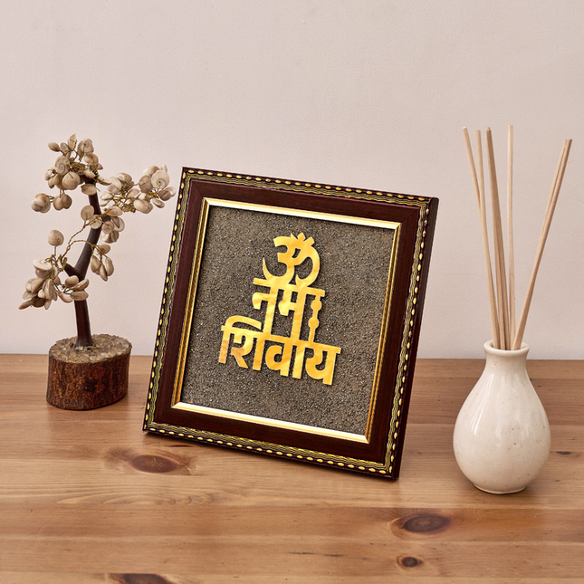 A sacred Om Namah Shivay wall frame featuring shimmering natural pyrite dust for divine protection and peace.