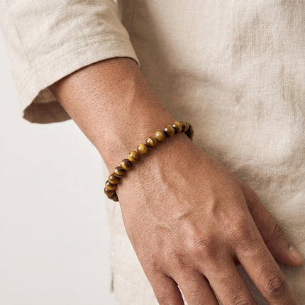 Authentic tiger eye gemstone stretch bracelet used as a powerful talisman for daily protection and grounding.