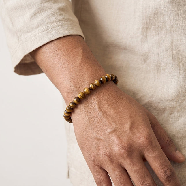 Authentic tiger eye gemstone stretch bracelet used as a powerful talisman for daily protection and grounding.