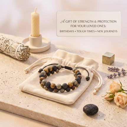 Triple Protection Bracelet presented on an elegant white drawstring pouch, highlighted as a meaningful gift for protection and emotional stability