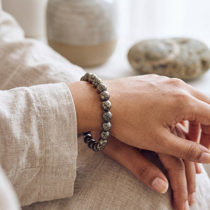 A lifestyle view of the raw pyrite gemstone bracelet showing its unique metallic texture and unisex style.