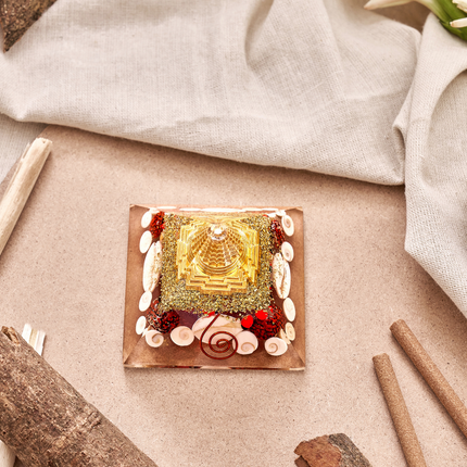 Shree Yantra orgone pyramid with Gomti Chakra used as home decor for Vastu balance, prosperity, and spiritual well-being